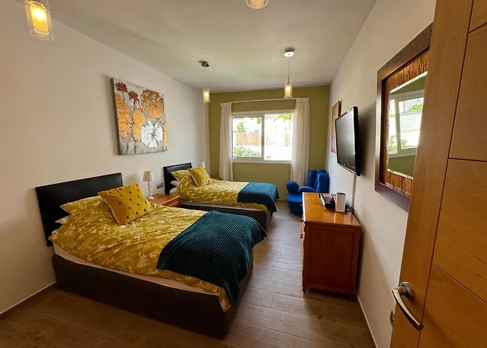 Villa Blossom In The Beautiful Area Of Puerto Santiago Tenerife With 5 Bedrooms For Up To 10 Guests Private Swimming Pool And Many Other Activities To Entertain The Family Secure Parking For 2 Cars And Disabled Access Throughout