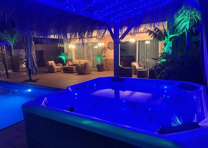 Blossom In The Beautiful Area Of Puerto Santiago Tenerife With 5 Bedrooms For Up To 10 Guests Private Swimming Pool And Many Other Activities To Entertain The Family Secure Parking For 2 Cars And Disabled Access Throughout