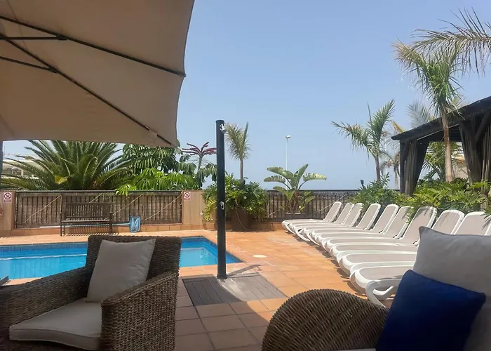 Blossom In The Beautiful Area Of Puerto Santiago Tenerife With 5 Bedrooms For Up To 10 Guests Private Swimming Pool And Many Other Activities To Entertain The Family Secure Parking For 2 Cars And Disabled Access Throughout Villa Puerto de Santiago