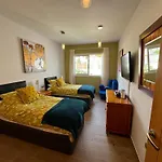 Villa Blossom In The Beautiful Area Of Puerto Santiago Tenerife With 5 Bedrooms For Up To 10 Guests Private Swimming Pool And Many Other Activities To Entertain The Family Secure Parking For 2 Cars And Disabled Access Throughout